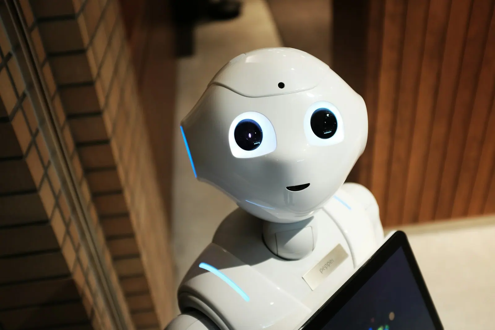 Industrial robot operating beside warehouse equipment