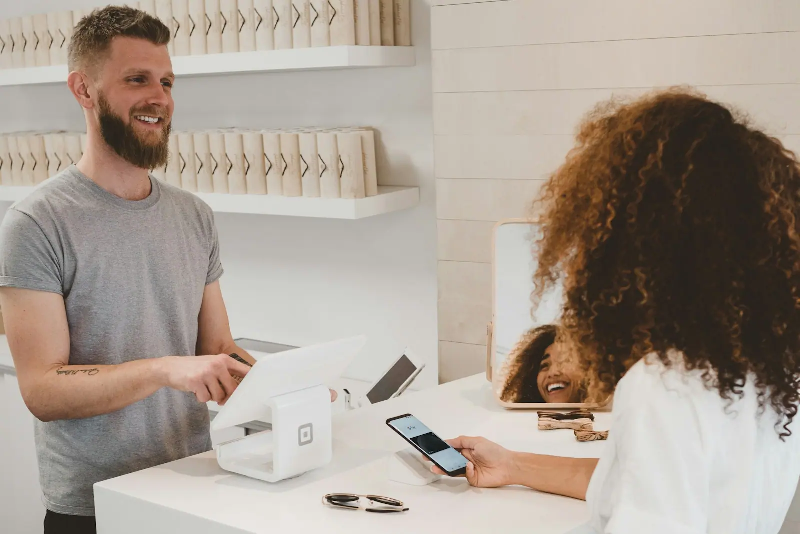 Small business owner working at a counter with a laptop
